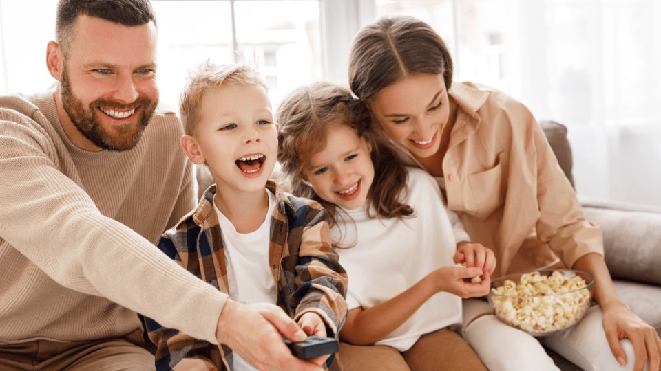 a family photo showing parents with two children